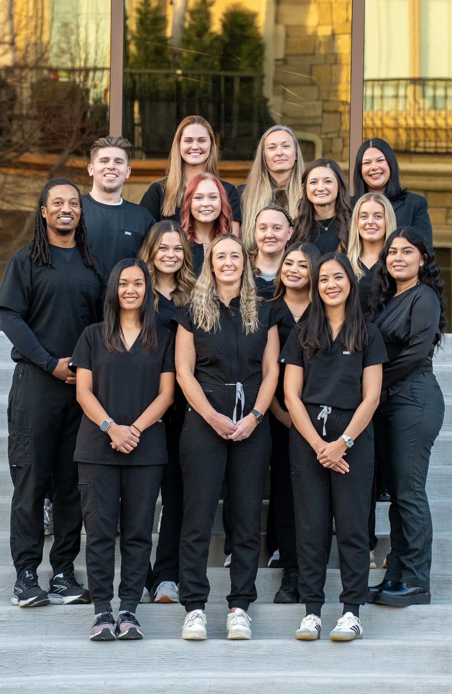 Cherry Creek Dental Spa clinical team wearing black scrubs outside the practice