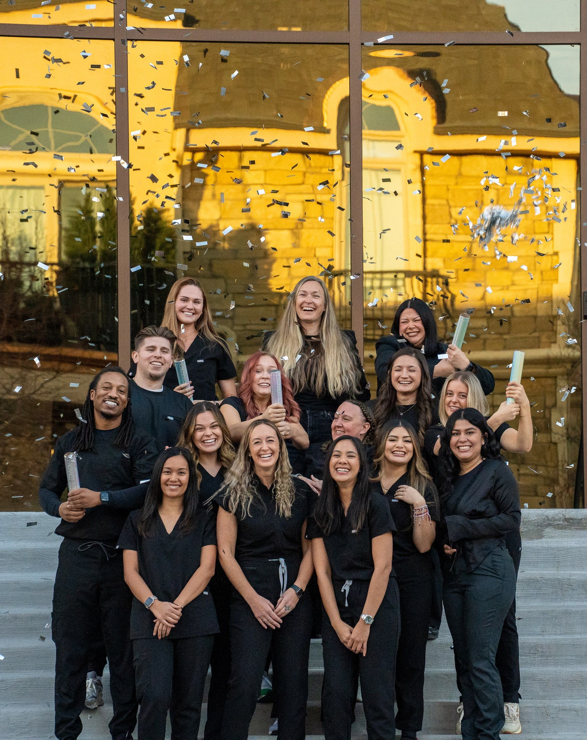 Cherry Creek Dental Spa clinical team celebrating with confetti outside the practice