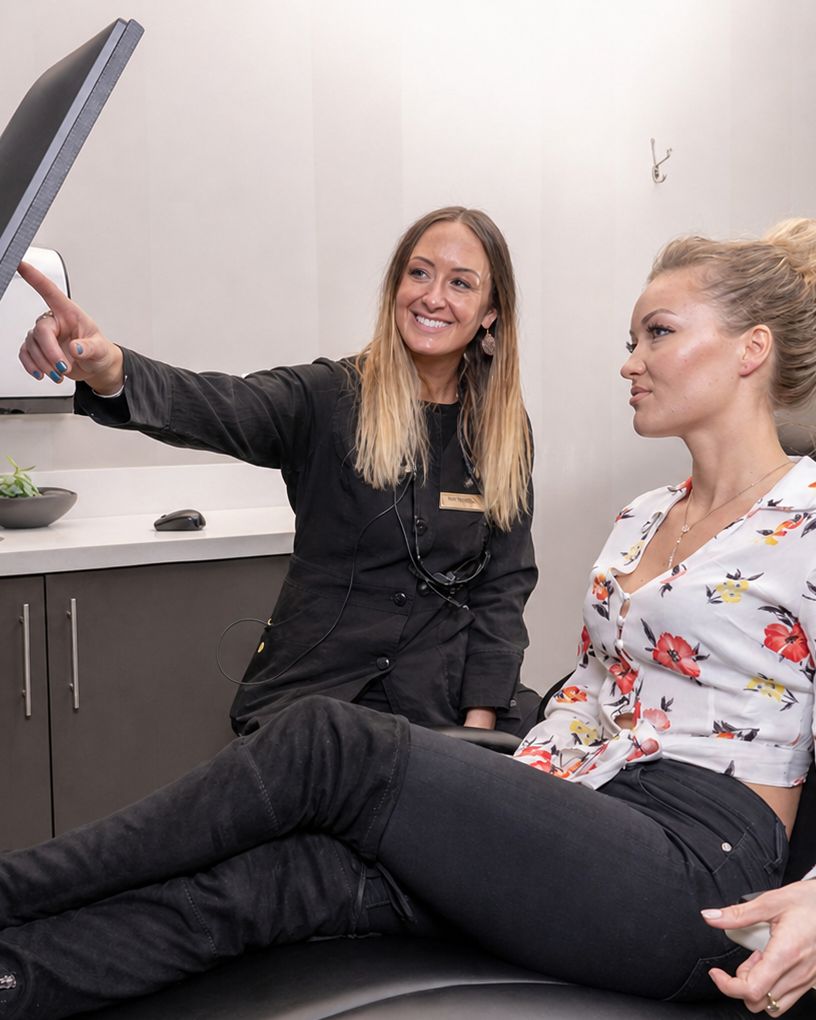 Cherry Creek Dental Spa clinician reviewing treatment information with a patient