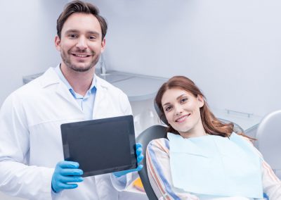 Patient and dentist with tablet